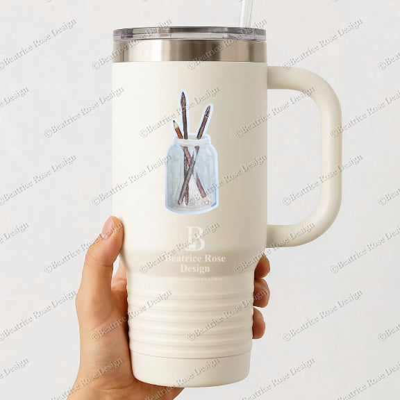 White insulated mug with handle held by a hand on a white background