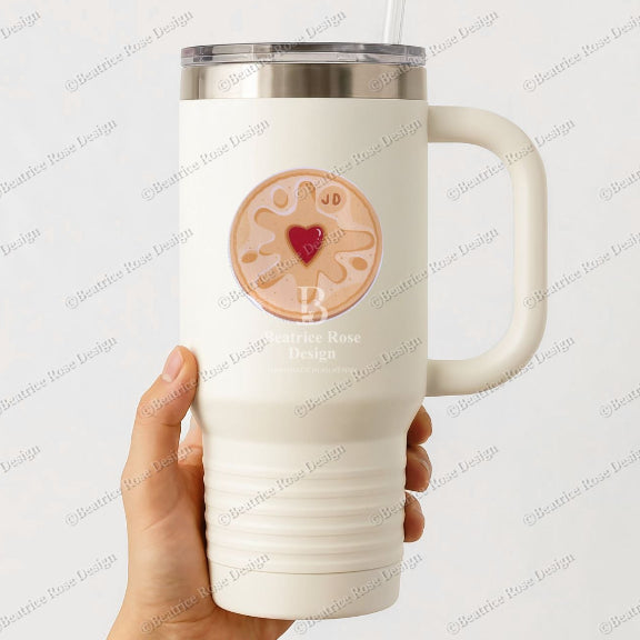 White insulated mug with a heart design held by a hand on a light gray background
