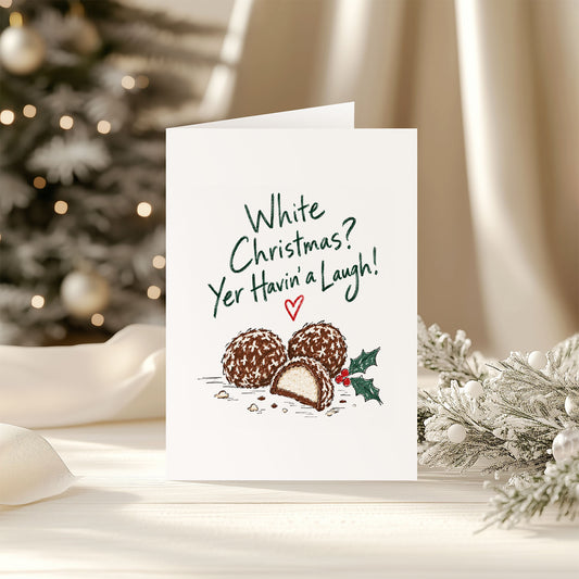 White Christmas Yer Havin’ a Laugh funny Irish Christmas card featuring chocolate-covered marshmallow Snowballs and holly